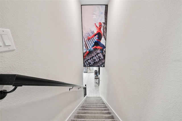 1128 Challenge Dr, Davenport, FL 33896 - staircase featuring a textured wall and baseboards