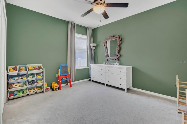 game room with a ceiling fan, carpet floors, and baseboards