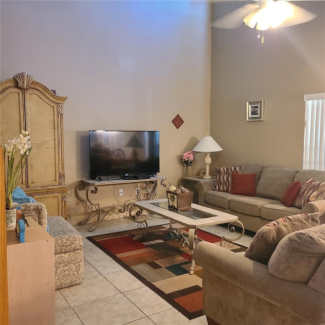 225 Vista Dr, Davenport, FL 33897 - living room featuring light tile patterned floors, a towering ceiling, and ceiling fan