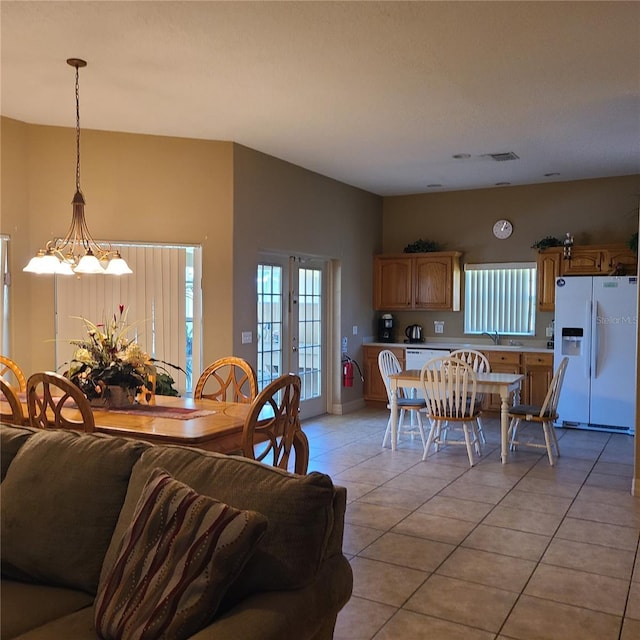 225 Vista Dr, Davenport, FL 33897 - dining area with light tile patterned flooring