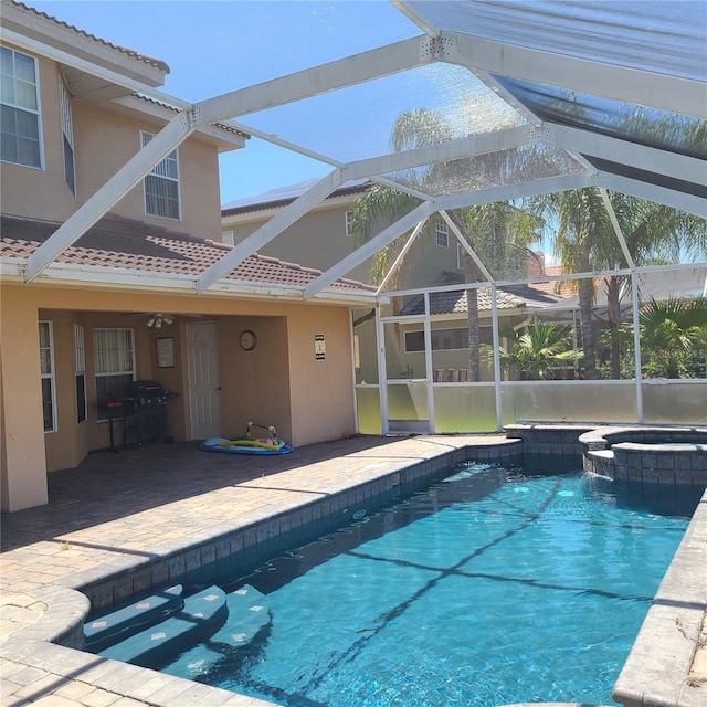 225 Vista Dr, Davenport, FL 33897 - view of pool with a patio area, a pool with connected hot tub, and glass enclosure