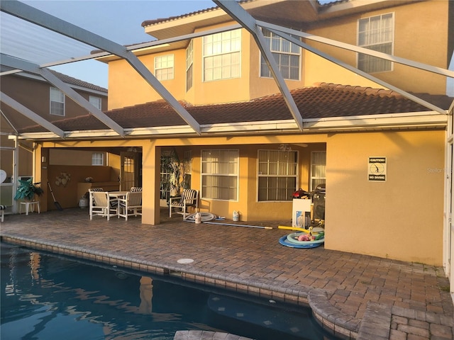 225 Vista Dr, Davenport, FL 33897 - back of property with a tile roof, a patio, and stucco siding