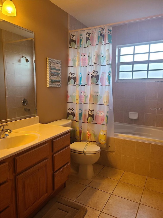225 Vista Dr, Davenport, FL 33897 - bathroom with tile patterned flooring, tiled shower / bath, toilet, and vanity