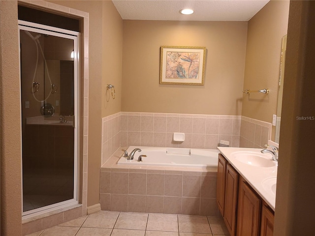225 Vista Dr, Davenport, FL 33897 - full bathroom featuring tile patterned flooring, a bath, a stall shower, and double vanity