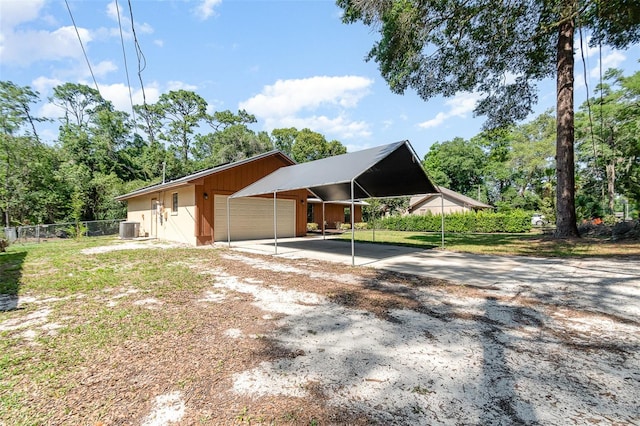 175 Cliff St, Deland, FL 32720 - view of front of house featuring fence, central air condition unit, an outbuilding, driveway, and view of scattered trees