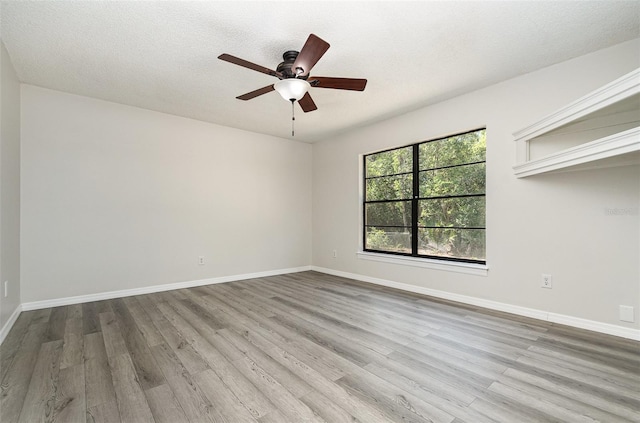 175 Cliff St, Deland, FL 32720 - unfurnished room with wood finished floors, a ceiling fan, baseboards, and a textured ceiling