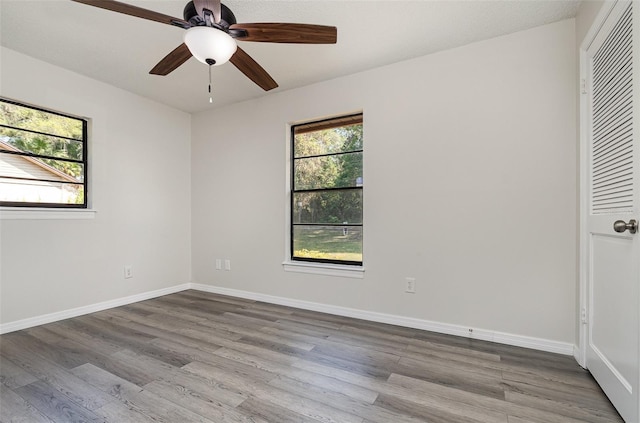 175 Cliff St, Deland, FL 32720 - unfurnished bedroom with wood finished floors, baseboards, and ceiling fan