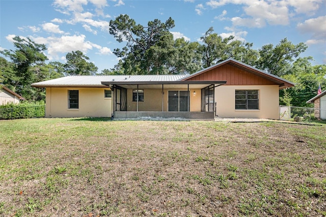 175 Cliff St, Deland, FL 32720 - view of front of home featuring a sunroom, stucco siding, and metal roof