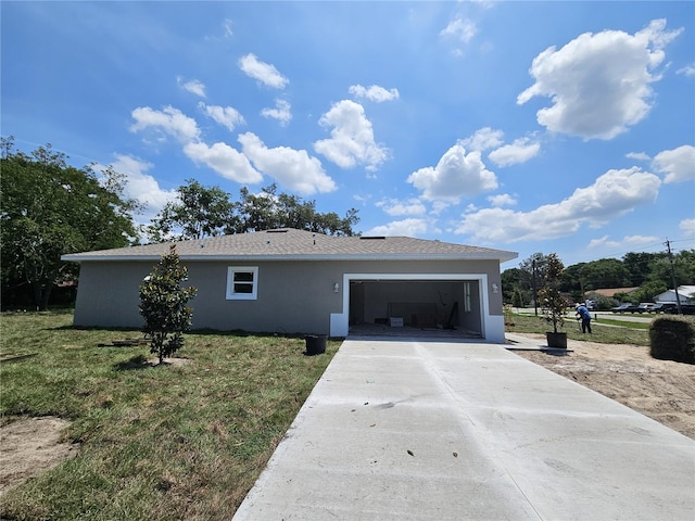 141 W G H Washington St, Apopka, FL 32703 - view of front of home featuring stucco siding, an attached garage, driveway, and a front yard