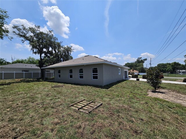 141 W G H Washington St, Apopka, FL 32703 - rear view of house with stucco siding