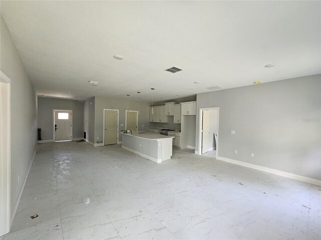 141 W G H Washington St, Apopka, FL 32703 - unfurnished living room with baseboards