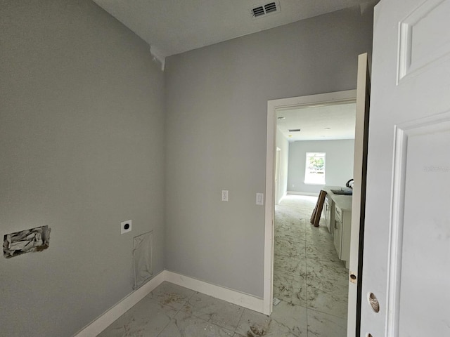 141 W G H Washington St, Apopka, FL 32703 - washroom with hookup for an electric dryer, light marble finish flooring, and baseboards
