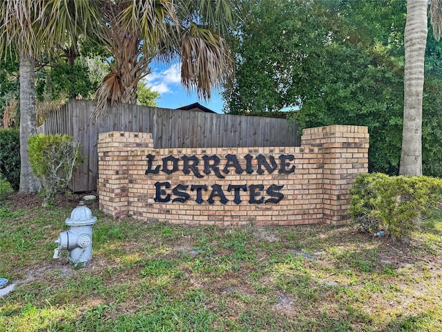 community sign with fence