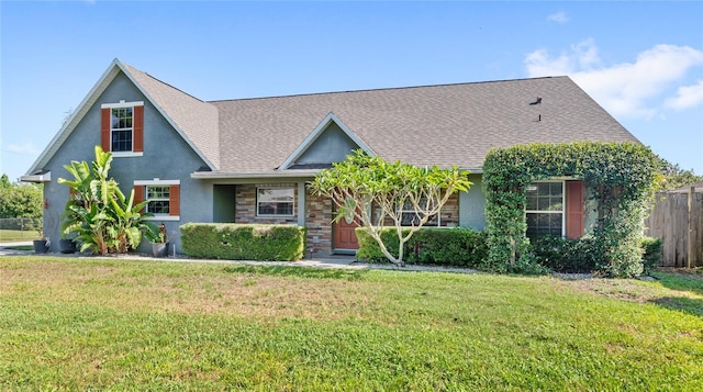 view of front of home with stucco siding and a shingled roof