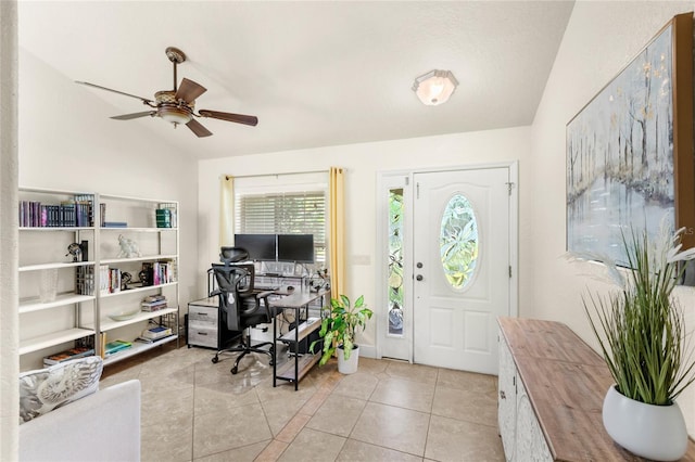 office area featuring lofted ceiling, a ceiling fan, and light tile patterned floors