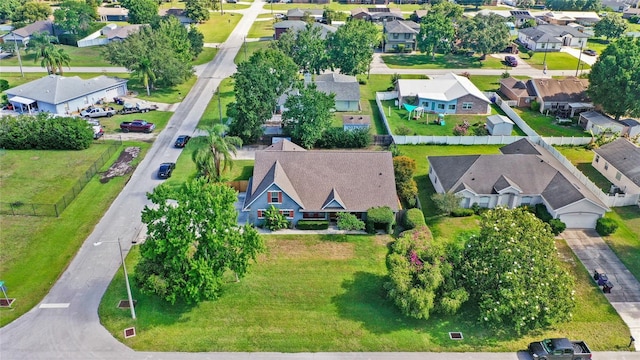 aerial view of property and surrounding area with nearby suburban area