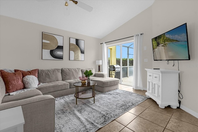 217 Holborn Loop, Davenport, FL 33897 - living room with light tile patterned floors, baseboards, ceiling fan, and high vaulted ceiling