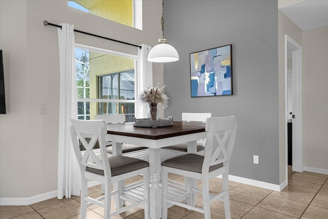 217 Holborn Loop, Davenport, FL 33897 - dining room featuring baseboards and light tile patterned floors