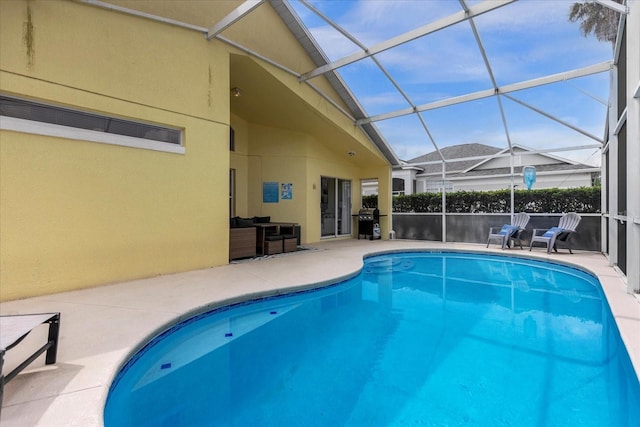 217 Holborn Loop, Davenport, FL 33897 - view of pool with a patio area, glass enclosure, and a grill