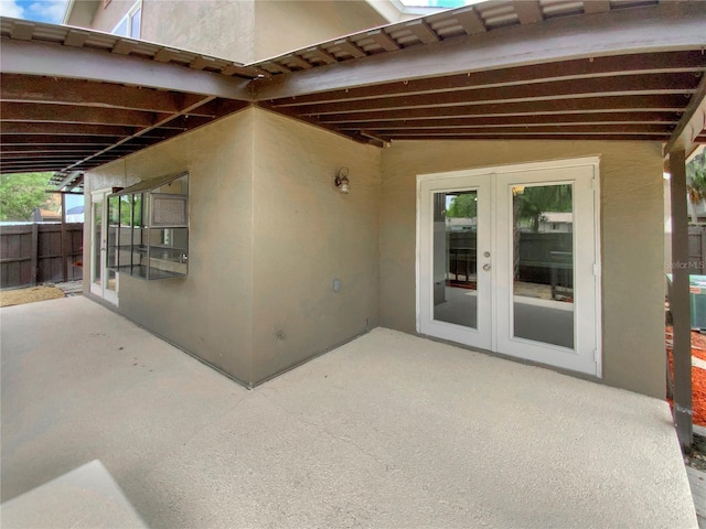 721 Rock Creek Loop, Longwood, FL 32750 - view of patio / terrace featuring french doors and fence