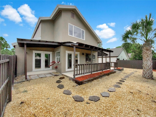 721 Rock Creek Loop, Longwood, FL 32750 - rear view of property featuring stucco siding, french doors, a patio, and a fenced backyard