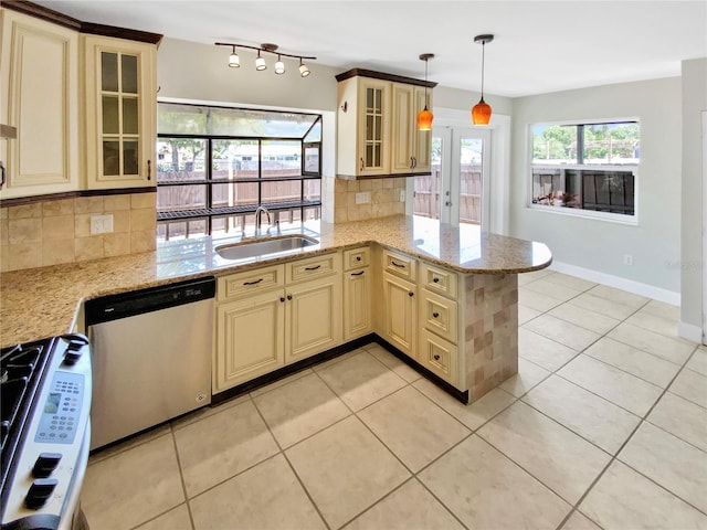 721 Rock Creek Loop, Longwood, FL 32750 - kitchen featuring cream cabinetry, a sink, dishwasher, and range with gas cooktop