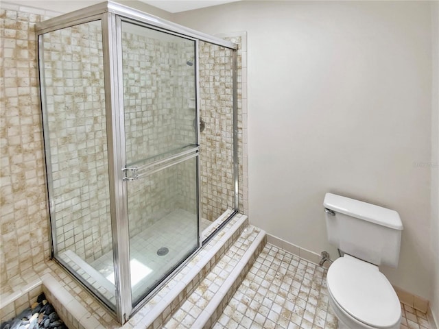 721 Rock Creek Loop, Longwood, FL 32750 - bathroom featuring a shower stall, toilet, baseboards, and tile patterned floors