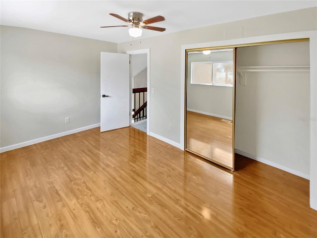 721 Rock Creek Loop, Longwood, FL 32750 - unfurnished bedroom with wood finished floors, baseboards, ceiling fan, and a closet