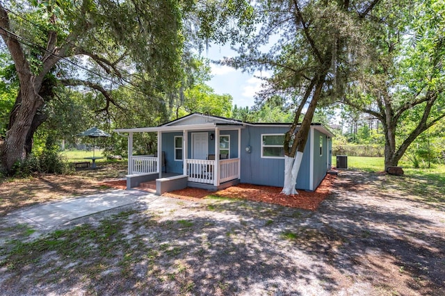 4515 Isaac Ln, Sanford, FL 32771 - view of front of property featuring a porch and central air condition unit