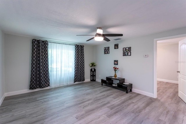 4515 Isaac Ln, Sanford, FL 32771 - living room with ceiling fan, wood finished floors, and baseboards