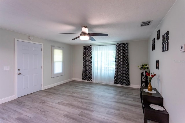 4515 Isaac Ln, Sanford, FL 32771 - entryway featuring a ceiling fan, light wood-style flooring, and baseboards