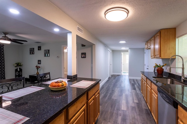 4515 Isaac Ln, Sanford, FL 32771 - kitchen featuring a sink, stainless steel dishwasher, dark wood-style floors, ceiling fan, and brown cabinetry