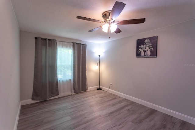 4515 Isaac Ln, Sanford, FL 32771 - unfurnished room featuring wood finished floors, a ceiling fan, and baseboards