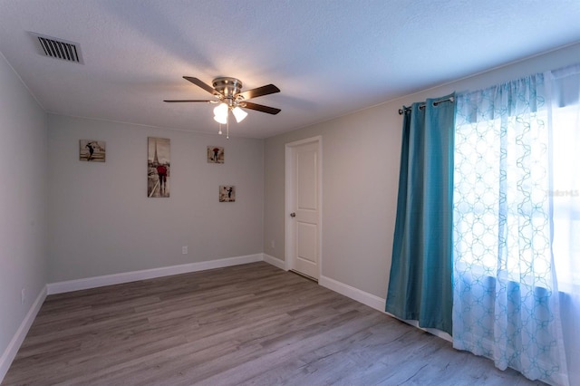 4515 Isaac Ln, Sanford, FL 32771 - spare room featuring a ceiling fan, wood finished floors, and baseboards