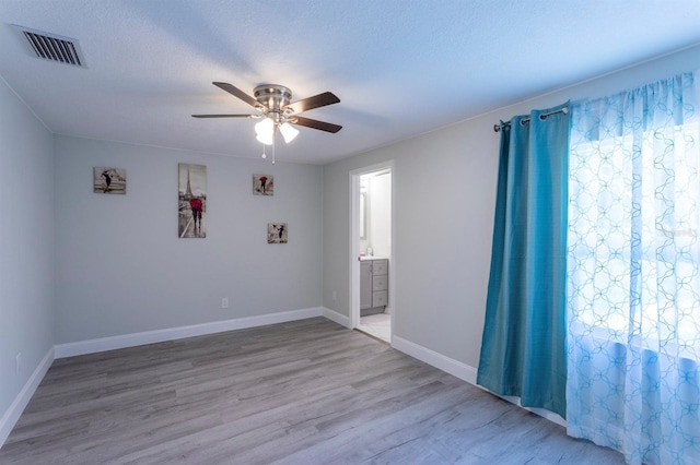 4515 Isaac Ln, Sanford, FL 32771 - spare room with ceiling fan, wood finished floors, and baseboards