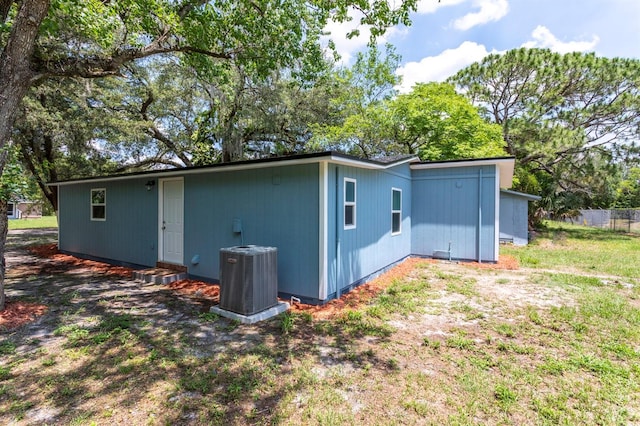 4515 Isaac Ln, Sanford, FL 32771 - back of house with central AC unit and entry steps