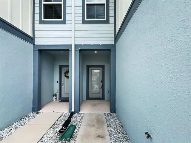 3737 Plainview Dr, Orlando, FL 32824 - property entrance with stucco siding