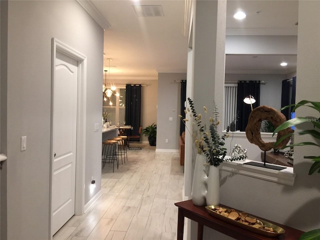 15708 Orange Harvest Loop, Winter Garden, FL 34787 - hallway with crown molding, baseboards, light wood-style flooring, and recessed lighting