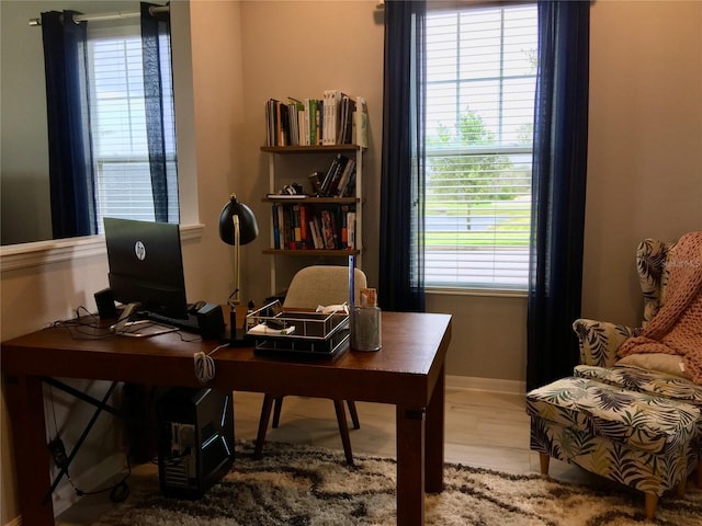 15708 Orange Harvest Loop, Winter Garden, FL 34787 - office with healthy amount of natural light, wood finished floors, and baseboards