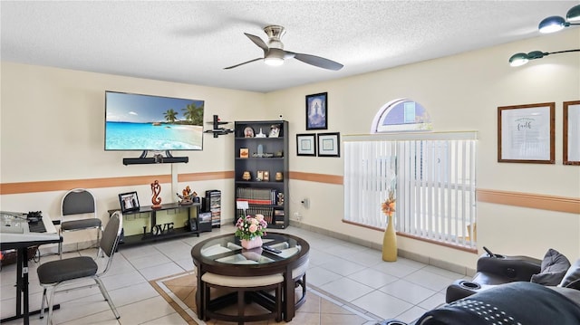 11257 Dacre Ln, Orlando, FL 32824 - tiled living area featuring ceiling fan and a textured ceiling
