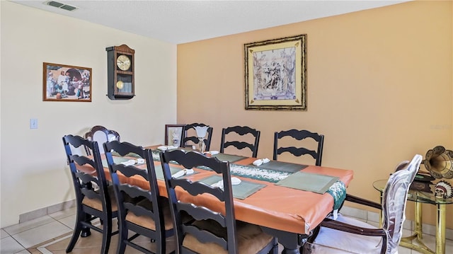11257 Dacre Ln, Orlando, FL 32824 - dining room with light tile patterned flooring and baseboards