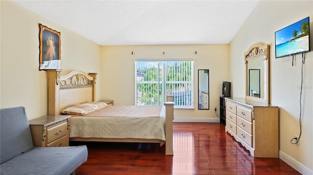 11257 Dacre Ln, Orlando, FL 32824 - bedroom with dark wood-style flooring, a textured ceiling, and baseboards