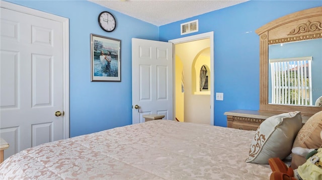 11257 Dacre Ln, Orlando, FL 32824 - bedroom featuring arched walkways
