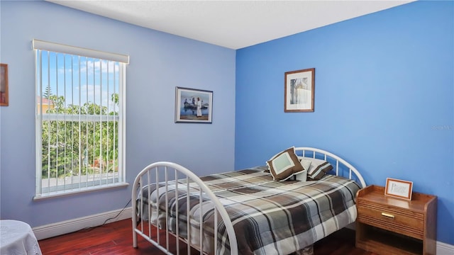 11257 Dacre Ln, Orlando, FL 32824 - bedroom featuring wood finished floors and baseboards
