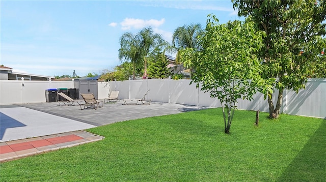 11257 Dacre Ln, Orlando, FL 32824 - view of yard featuring a patio, a storage shed, and an outbuilding