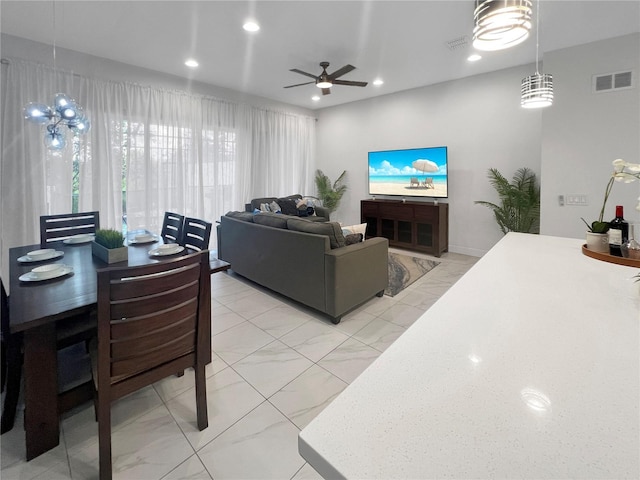 454 Captiva Dr, Davenport, FL 33896 - living area featuring light marble finish flooring, a ceiling fan, and recessed lighting
