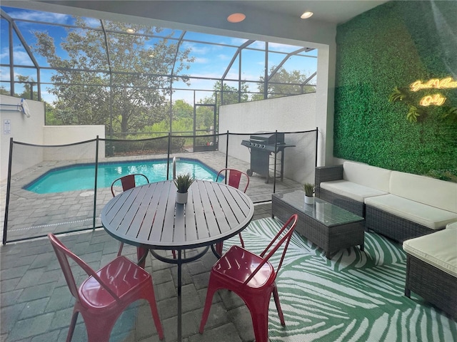 454 Captiva Dr, Davenport, FL 33896 - outdoor pool featuring a patio area, glass enclosure, an outdoor hangout area, and grilling area