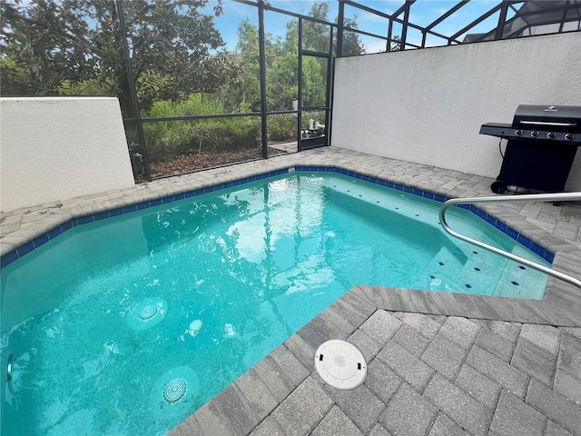 454 Captiva Dr, Davenport, FL 33896 - outdoor pool with a lanai, a grill, and a patio area