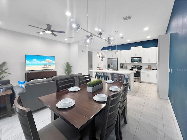 454 Captiva Dr, Davenport, FL 33896 - dining space with light marble finish flooring, a ceiling fan, recessed lighting, and baseboards