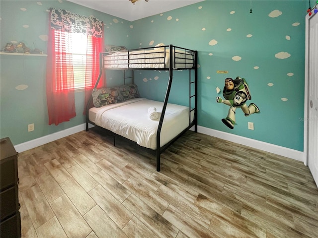 454 Captiva Dr, Davenport, FL 33896 - bedroom featuring wood finished floors and baseboards